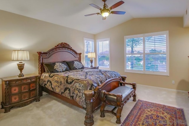 carpeted bedroom featuring ceiling fan and vaulted ceiling