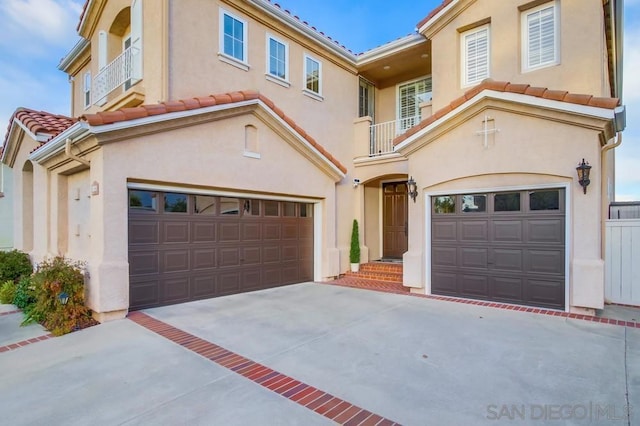 mediterranean / spanish house featuring a garage