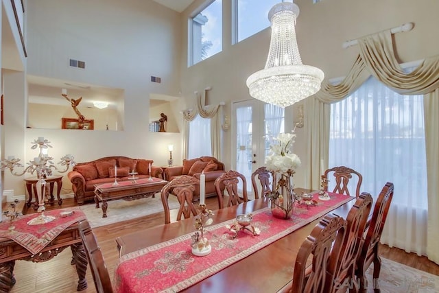 dining room with an inviting chandelier and hardwood / wood-style floors