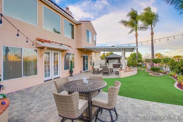 view of patio / terrace with a gazebo, outdoor lounge area, and french doors