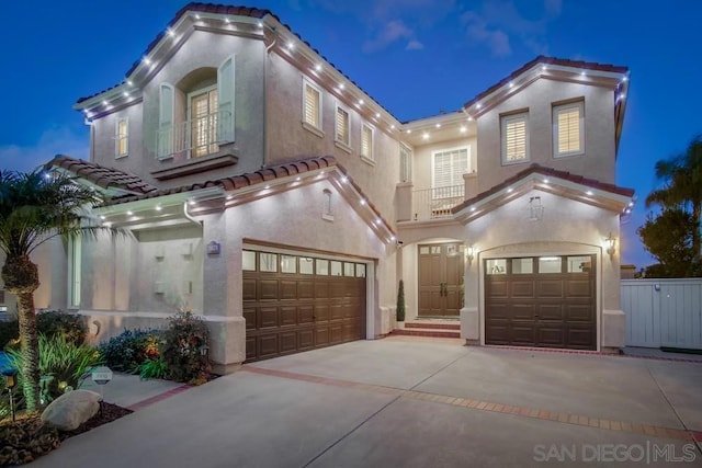 mediterranean / spanish house with a garage