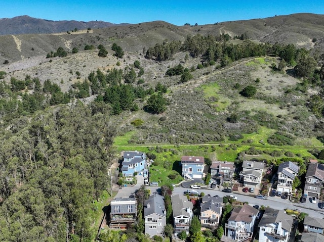 birds eye view of property featuring a mountain view