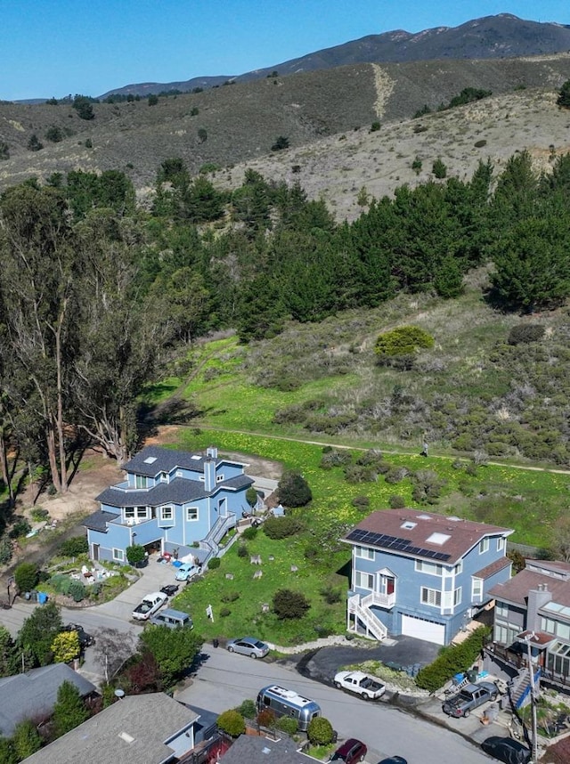 birds eye view of property with a mountain view