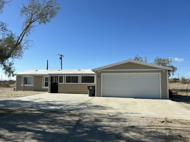 single story home with a garage