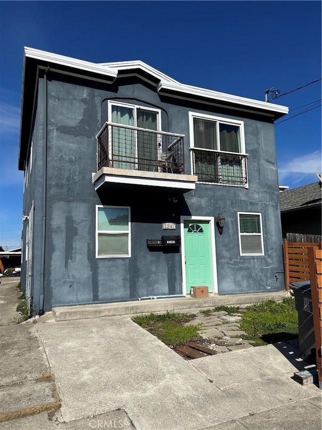 view of front of property with a balcony