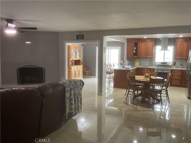 dining area with sink and ceiling fan