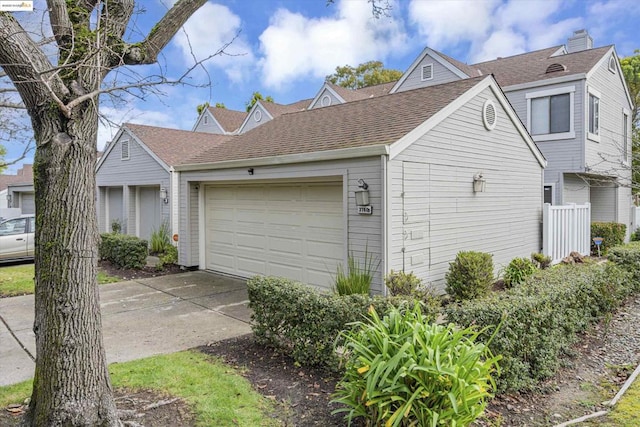 view of side of home featuring a garage