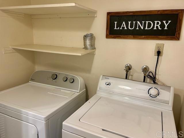 laundry room with laundry area and washer and clothes dryer