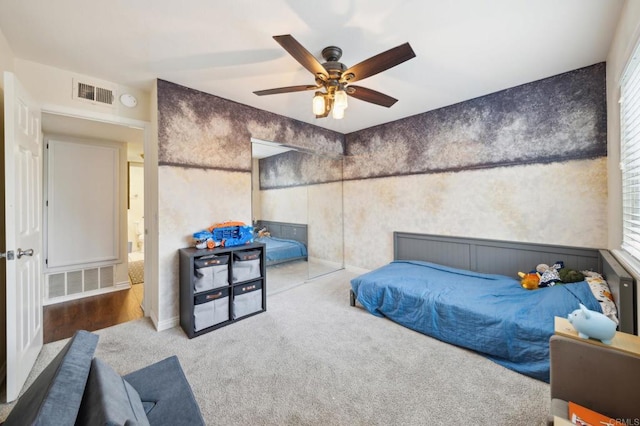 bedroom featuring ceiling fan, carpet floors, and visible vents