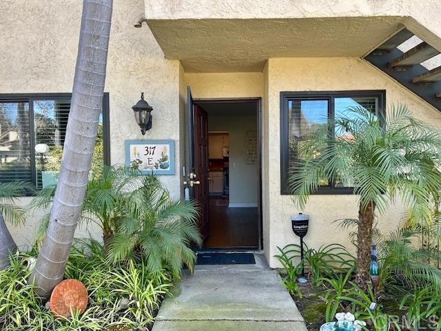 317 N Melrose Dr Unit E, Vista, CA 92083 - view of exterior entry with stucco siding
