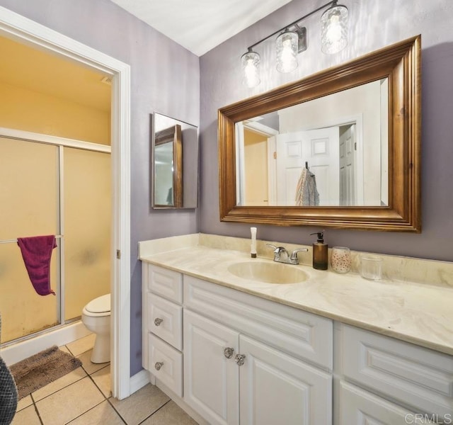 317 N Melrose Dr Unit E, Vista, CA 92083 - bathroom with tile patterned flooring, vanity, a shower stall, and toilet