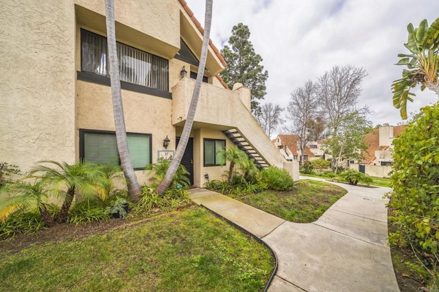317 N Melrose Dr Unit E, Vista, CA 92083 - view of property featuring stairs