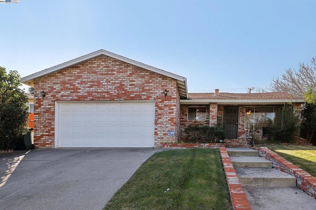 view of front of home with a garage and a front lawn