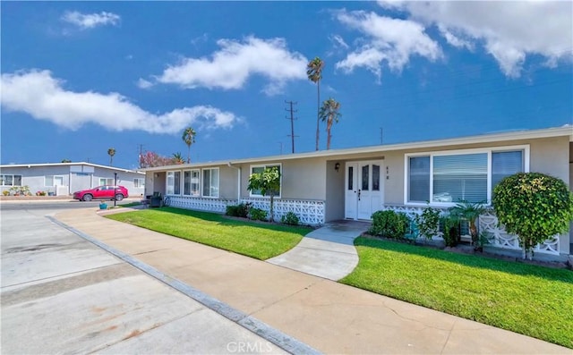 ranch-style home with a front yard