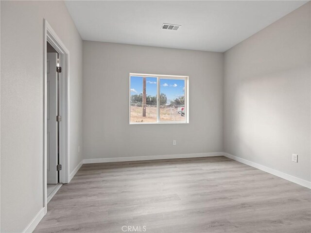 8411 Buckthorn Ave, Hesperia, CA 92345 - spare room featuring wood finished floors and baseboards