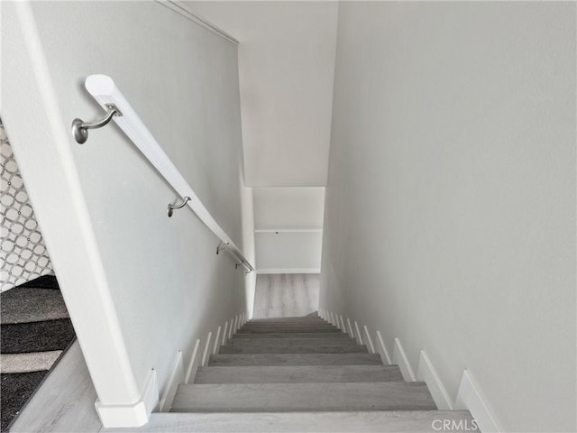 stairs with wood finished floors