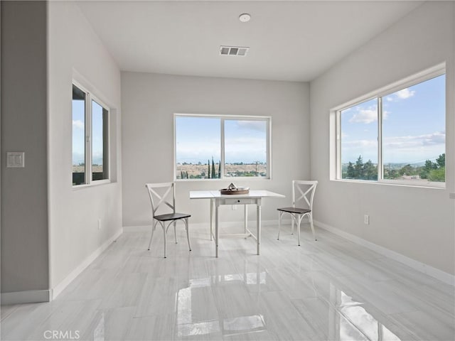 sitting room with baseboards and visible vents