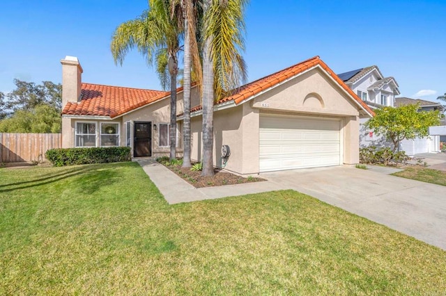 view of front of house featuring a garage and a front lawn