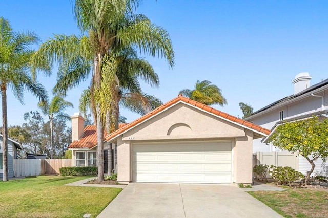 view of front of house with a garage and a front yard