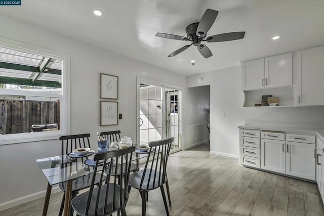 dining area featuring ceiling fan and light wood-type flooring