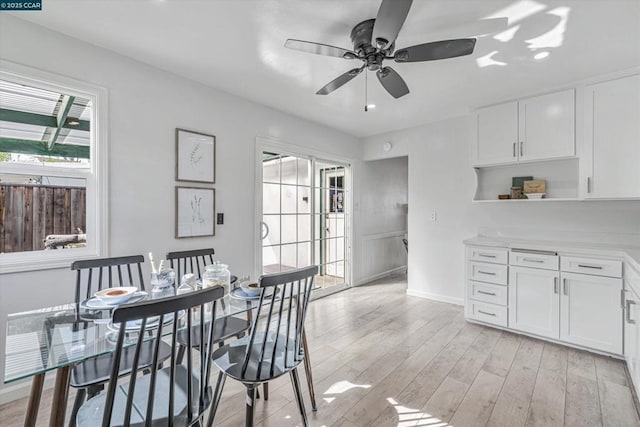 dining room featuring ceiling fan and light hardwood / wood-style flooring