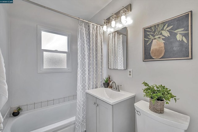 full bathroom with vanity, toilet, and shower / tub combo with curtain