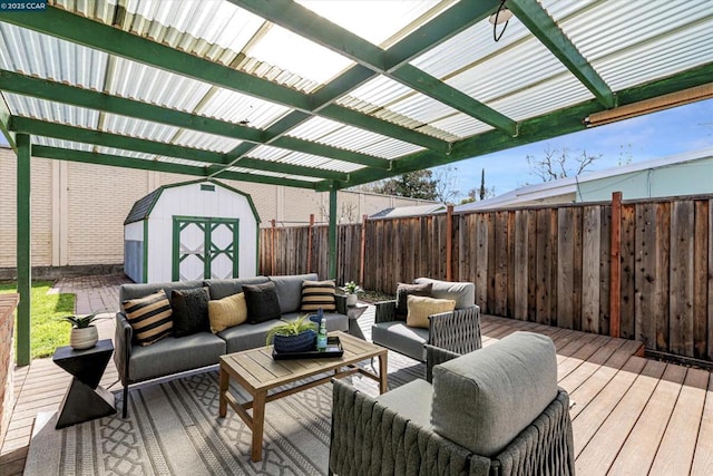 deck with a shed, a pergola, and outdoor lounge area