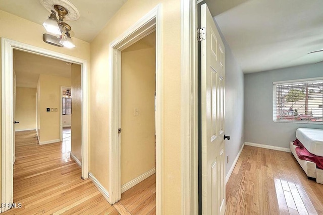 hallway with light wood-type flooring