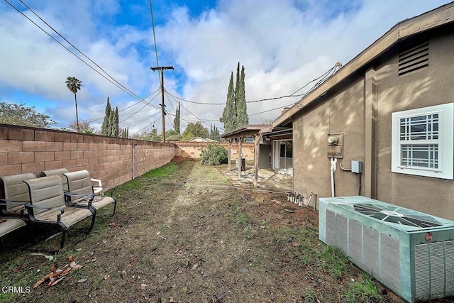 view of yard with central AC