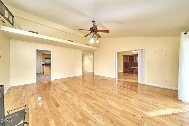 unfurnished living room with lofted ceiling, light hardwood / wood-style flooring, and ceiling fan