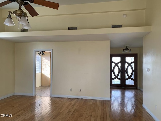 entryway with hardwood / wood-style flooring and ceiling fan