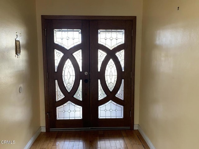 entrance foyer with hardwood / wood-style floors and french doors