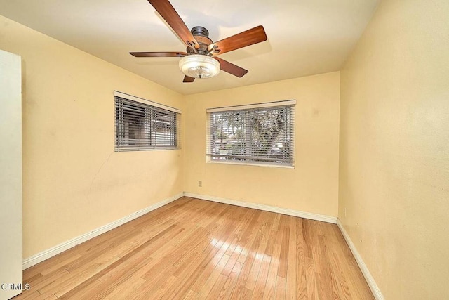 unfurnished room with ceiling fan and light wood-type flooring