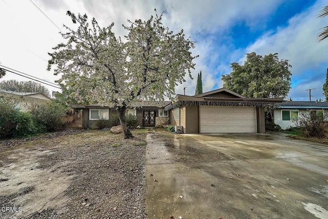 single story home with a garage