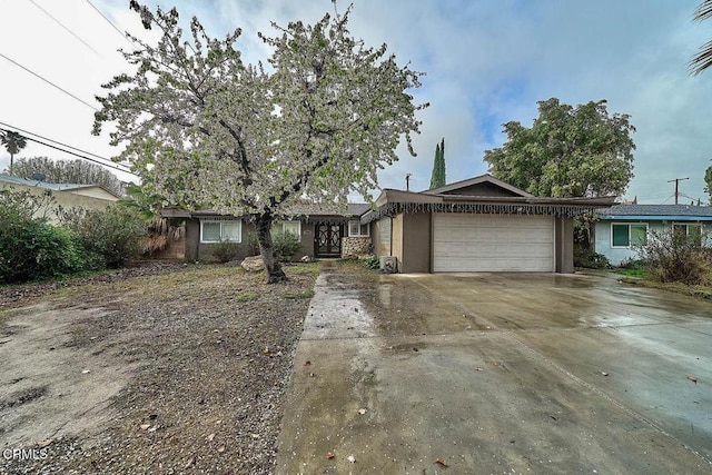 single story home featuring a garage