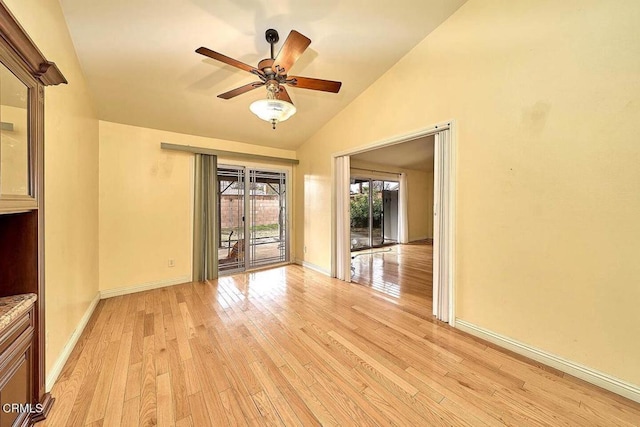 unfurnished room with ceiling fan, lofted ceiling, and light hardwood / wood-style flooring