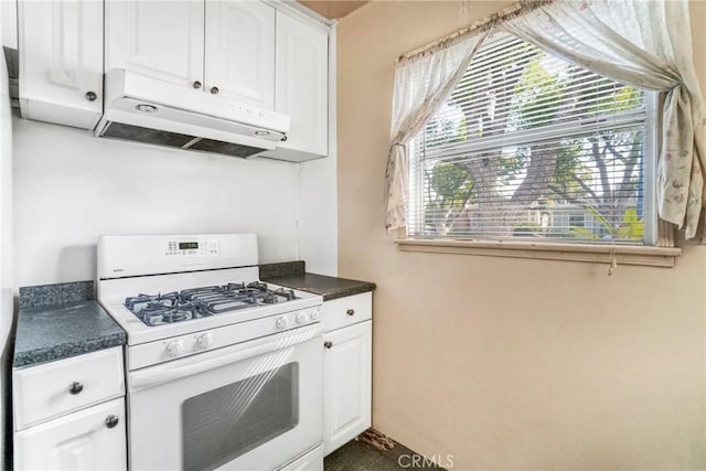 kitchen featuring white cabinetry and gas range gas stove