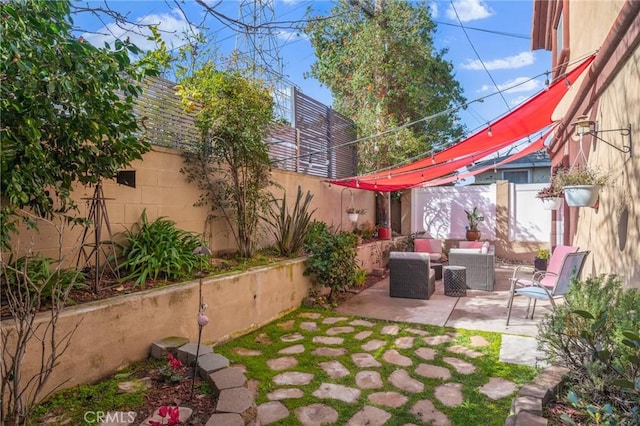 view of patio / terrace with an outdoor hangout area and a fenced backyard