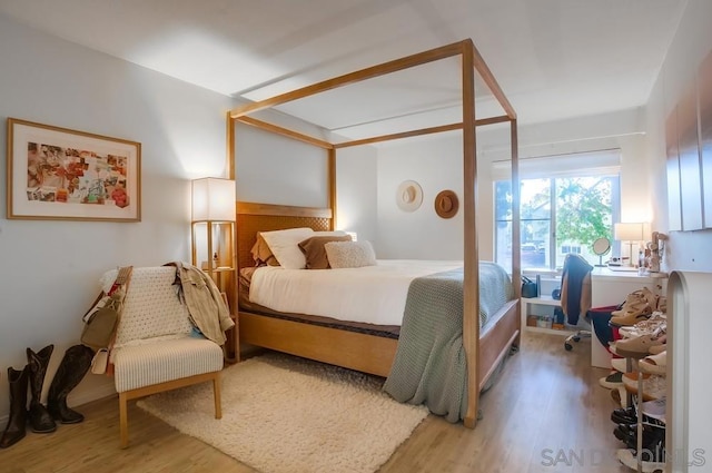 bedroom with wood-type flooring