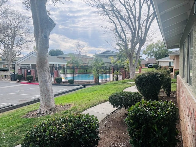 view of yard featuring a community pool