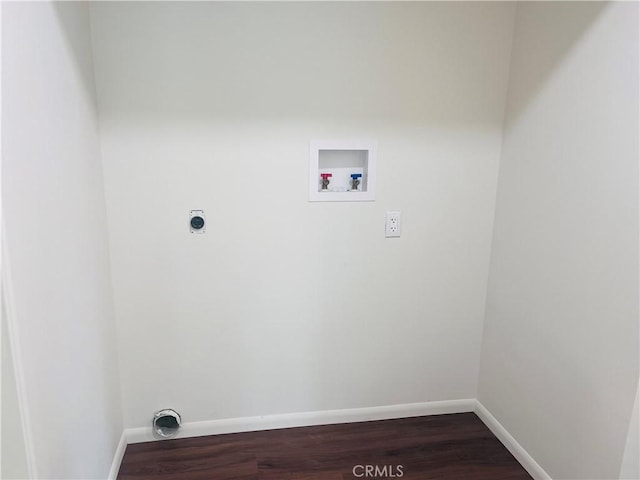 clothes washing area with hardwood / wood-style floors, electric dryer hookup, and washer hookup