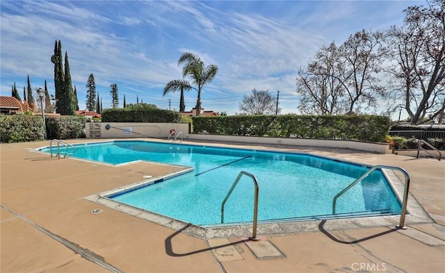 view of swimming pool featuring a patio area