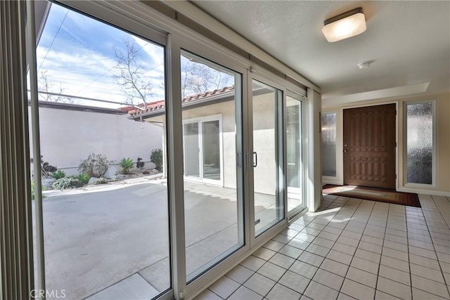 entryway featuring light tile patterned floors