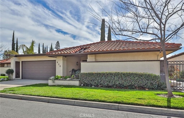 view of front of house with a garage and a front yard