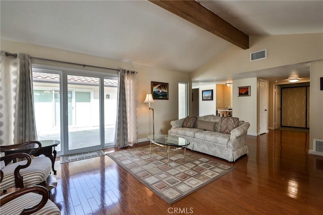 living room featuring hardwood / wood-style floors and vaulted ceiling with beams