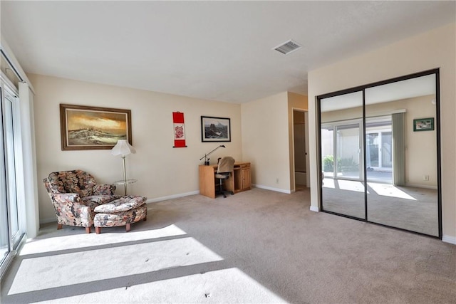 sitting room with light colored carpet