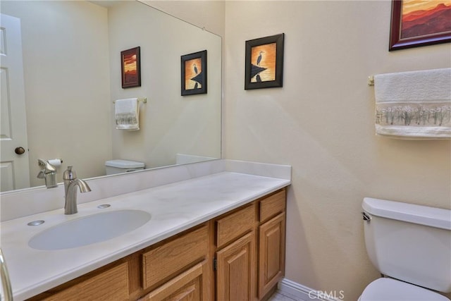 bathroom with vanity and toilet