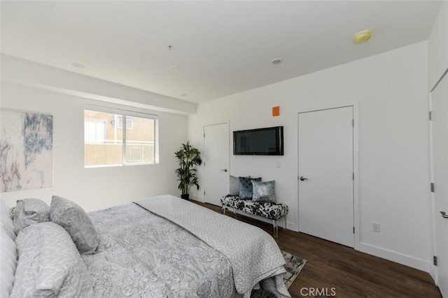 bedroom featuring dark wood-type flooring