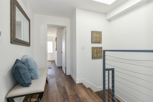 hallway with dark hardwood / wood-style flooring