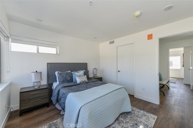 bedroom featuring dark hardwood / wood-style flooring